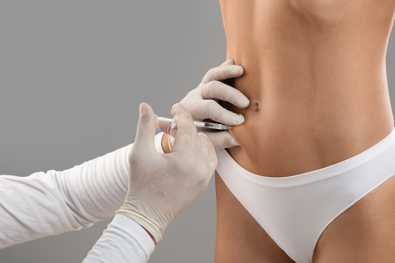 Doctor Injecting Lipolysis Shot on Person's Abdomen